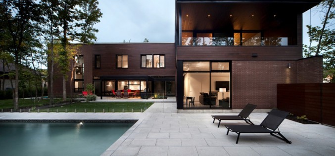 A Family Home In A Forest Setting Covered In Local Clay Bricks And Cedar