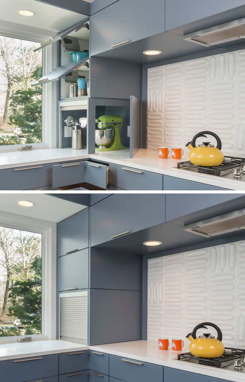 Kitchen Design Idea - Store Your Kitchen Appliances In A Dedicated Appliance Garage // The silver garage door slides up to reveal the inside of the appliance storage spot, while the blue cupboard door opens on the other side to provide even more access to the appliances when you need to use them.