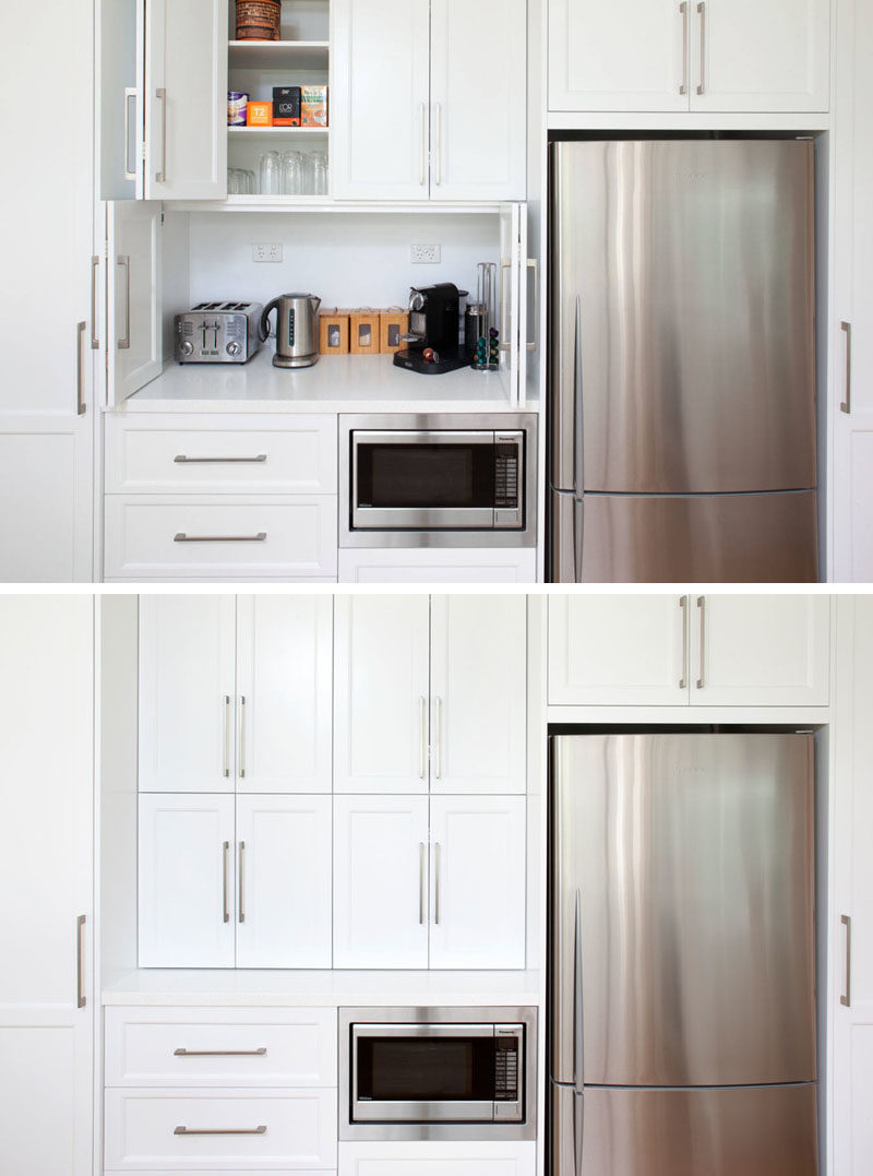 Kitchen Design Idea - Store Your Kitchen Appliances In A Dedicated Appliance // Folding doors hide the space above the microwave large enough to store multiple appliances and everything you need to make a comforting cup of tea.