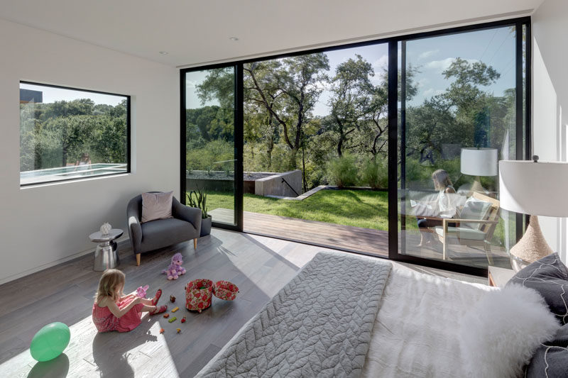 This bedroom has a double sliding door, allowing it to be completely open to the backyard and pool area. 
