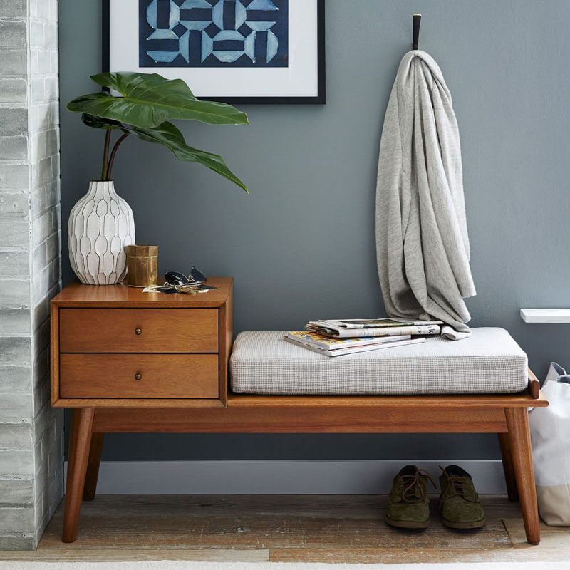 Entryway Design Ideas - 3 Different Styles Of Entryway Benches // This bench has a small table with two drawers attached to it creating the perfect drop zone for keys, glasses, and bits of paper you fish out of your pockets when you get home.