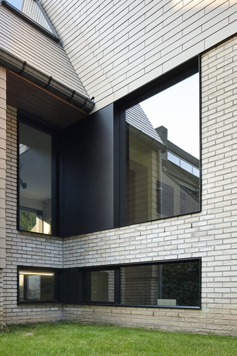 Black framed windows were included in the renovation of this brick home.