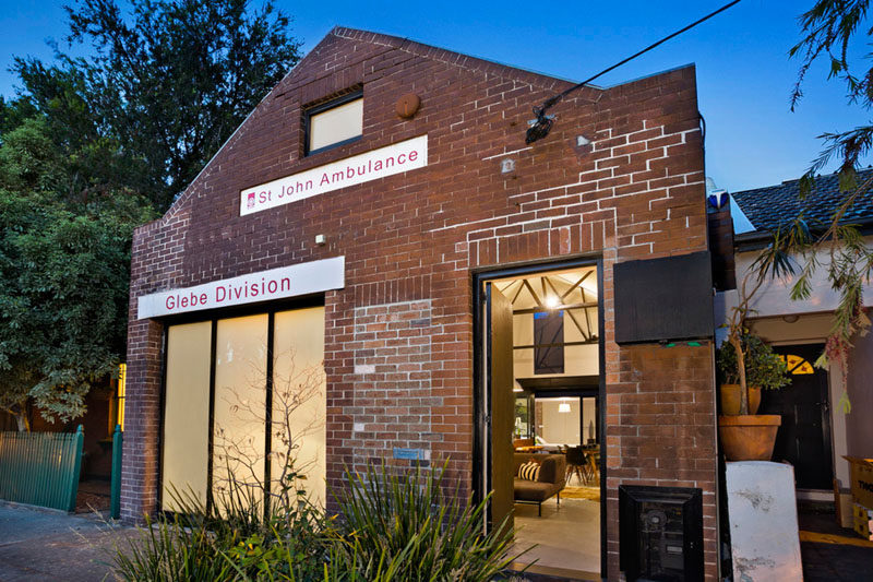This former St. John's ambulance station in Sydney, Australia, has been transformed in an urban home with brick walls, vaulted ceilings and an open floor plan.