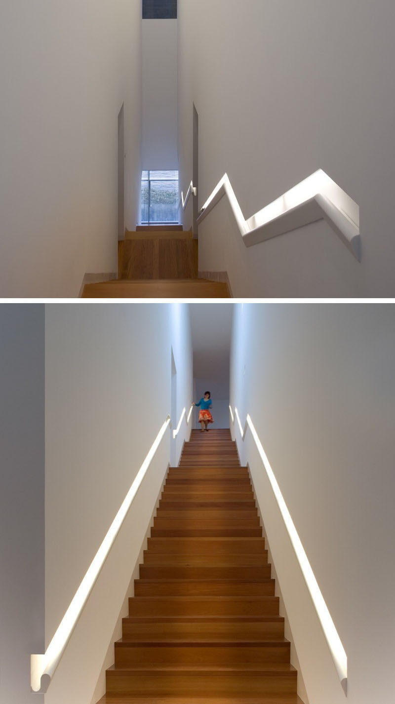 Stair Design Idea - 9 Examples Of Built-In Handrails // This built-in handrail that runs the length of the stairs does double-duty as a light source.