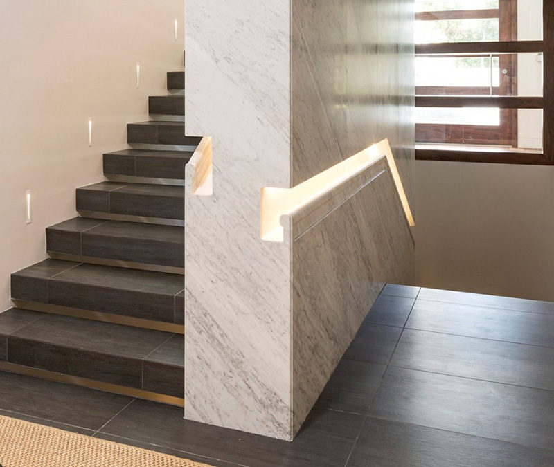 Stair Design Idea - 9 Examples Of Built-In Handrails // In this home, the stair handrail was first built into the wall, which was then clad in marble.