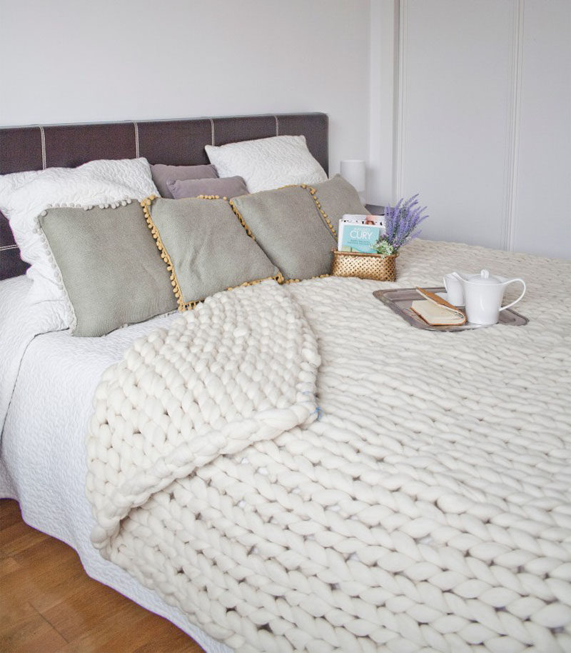 Bedroom Design Idea - 7 Ways To Create A Warm And Cozy Bedroom // Chunky blankets draped over the end of your bed or hanging on the back of a chair in your room also add a huge amount of texture and warmth to your space both figuratively and literally.
