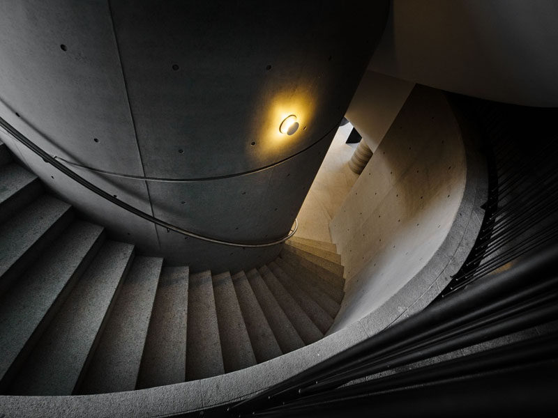 Spiraling concrete stairs lead you to the various floors of this clubhouse.