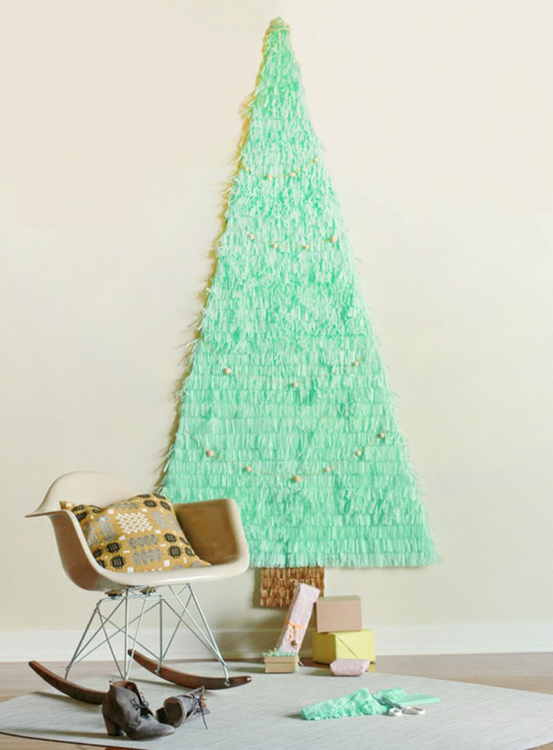 Christmas Decor Ideas - 14 DIY Alternative Modern Christmas Trees // All you need to make this simple space saving tree is some tissue paper, poster board, tape and scissors.