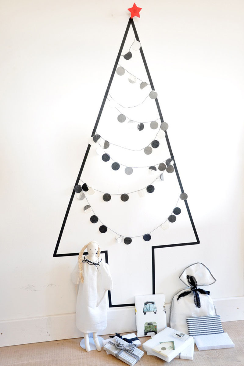 Christmas Decor Ideas - 14 DIY Alternative Modern Christmas Trees // This all black washi tape tree creates a minimal Christmas display that can be decorated or left empty and makes a spot perfect for piling up presents.