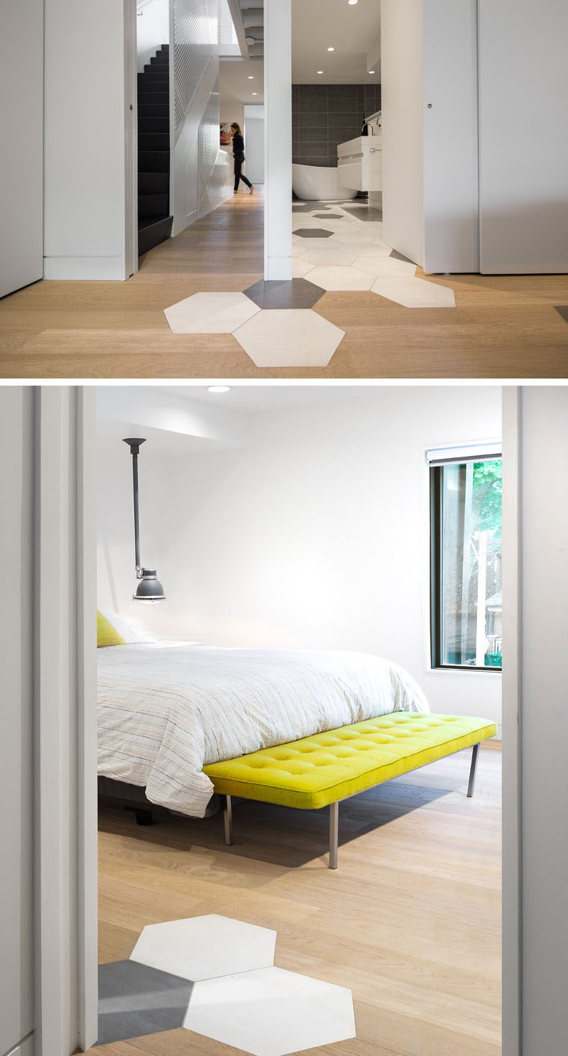 In this bedroom and ensuite, large hexagonal tiles flow from the bathroom floor into the bedroom.
