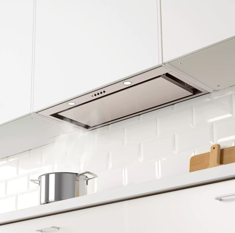 Kitchen Design Idea - Hide The Range Hood // A fake cabinet conceals this range hood that can only be seen when looked at from underneath.