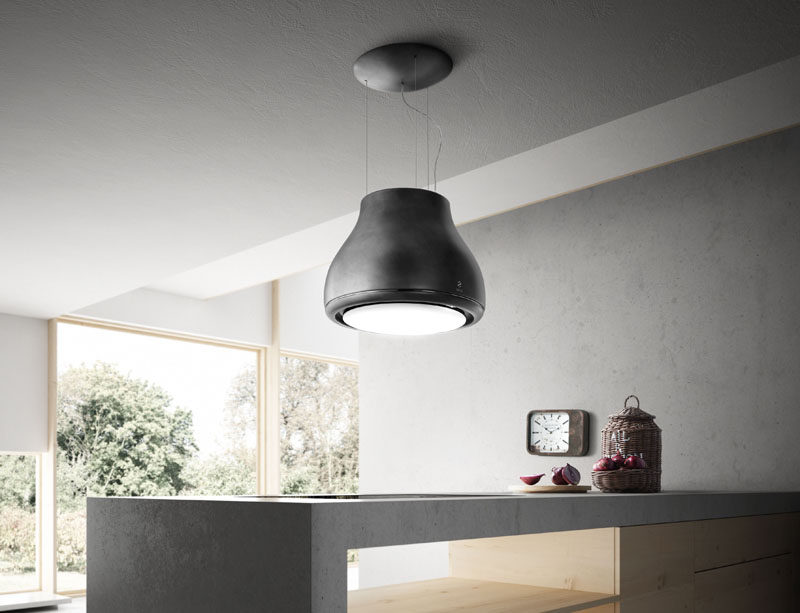 Kitchen Design Idea - Hide The Range Hood // This range hood is surrounded by a light fixture. A charcoal filter filters out the smoke, odors, and steam purifying the air as it flows out the top. Watch the video below to see it in action.