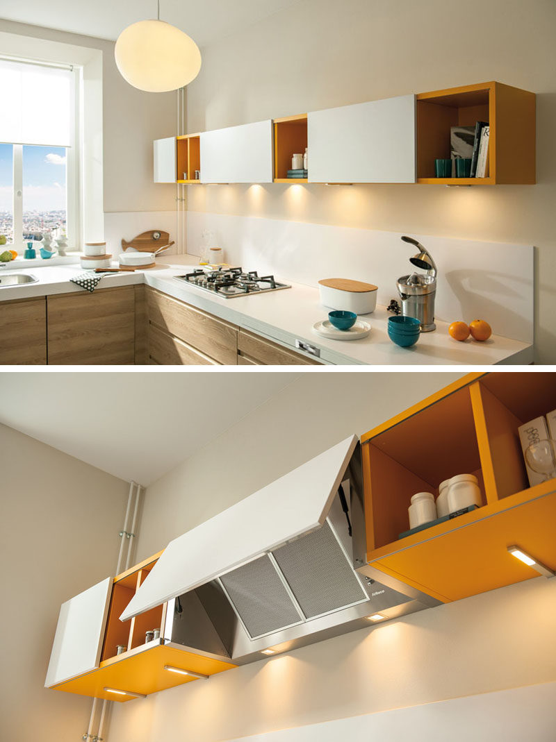 Kitchen Design Idea - Hide The Range Hood // The door covering this range hood matches the other white cabinet doors on this yellow shelving unit effectively hiding the hood and and blending it in with the rest of the kitchen.