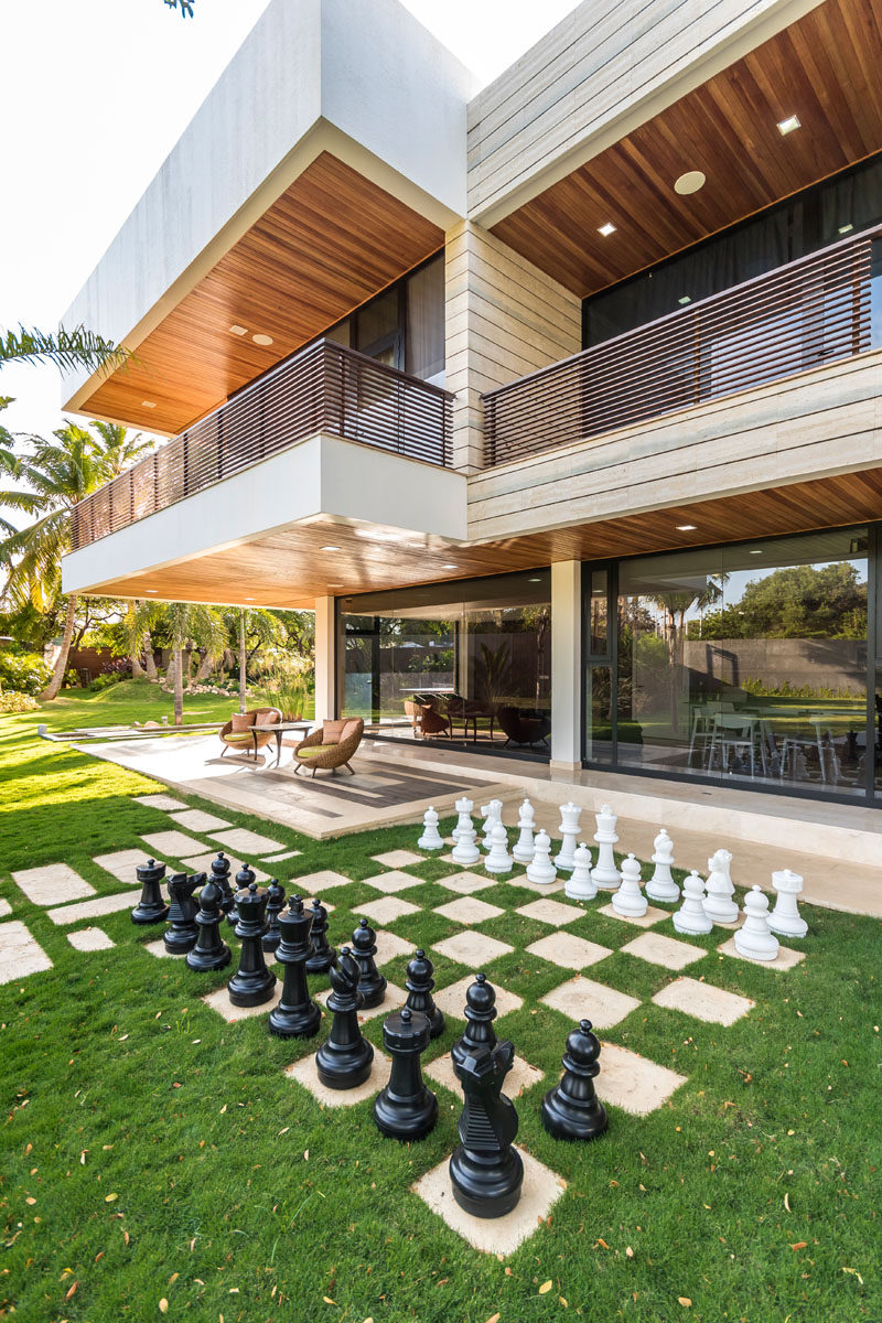 Landscaping Ideas - Liven Up Your Backyard With Some Games // The backyard of this modern home has a built-in chess set.