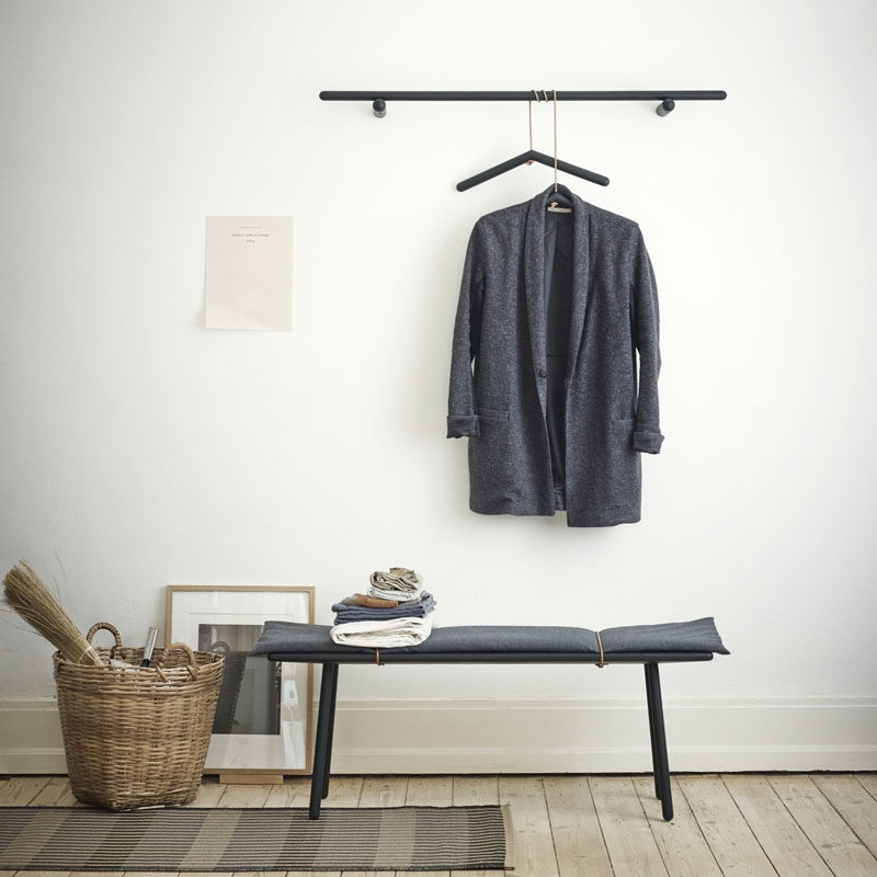 Entryway Design Ideas - 3 Different Styles Of Entryway Benches // A simple bench with light padding and a matching coat rack make this small entryway look put together and very minimal.