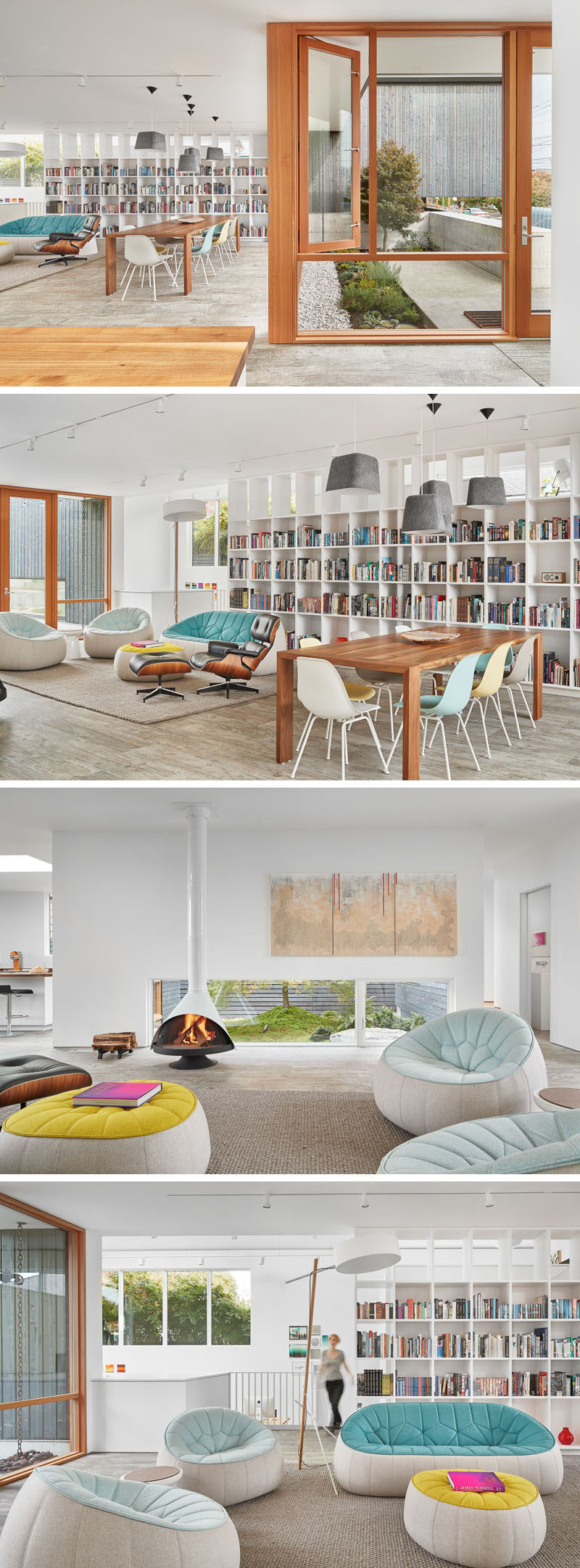 Inside this modern home, the living room has a wall of custom bookshelves, comfortable sofas and a wooden dining table surrounded by colored chairs.