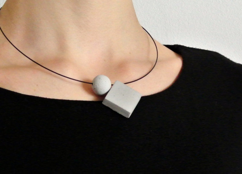 The Ultimate Gift Guide For The Modern Woman (40 Ideas!) // Concrete geometric pendants on a matte black necklace make a simple statement and can be dressed up and down.