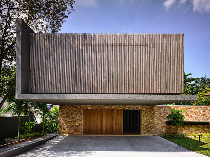 This house combines wood, concrete and brick for a modern look.