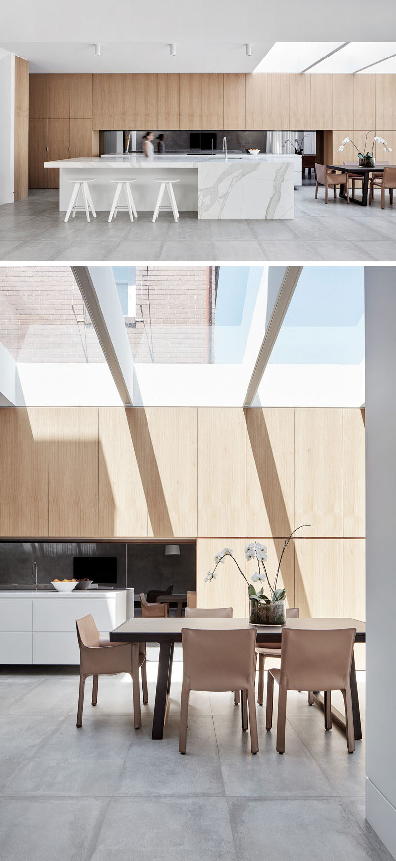This modern kitchen has a nice light feel to it with the use of light wood and light marble. The dining room shares the space and has plenty of natural light from the large skylight above.