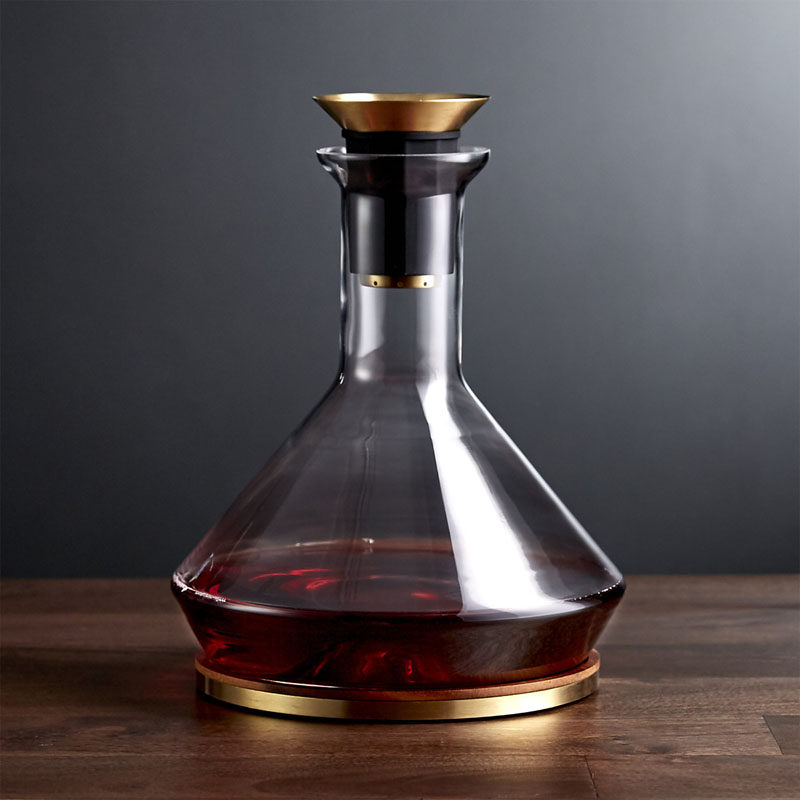 10 Unique Modern Wine Decanters // Pour your bottle of wine into this glass and brass decanter that features a filter for catching sediments and a wood base to catch any drips.