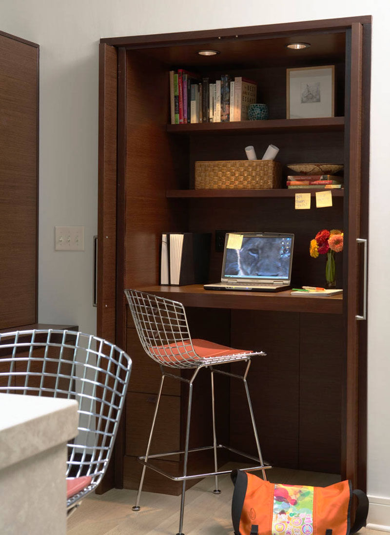 Small Apartment Design Ideas - Create A Home Office In A Closet // The desk of this closet office is raised up to create more leg space and provide more drawer storage underneath.