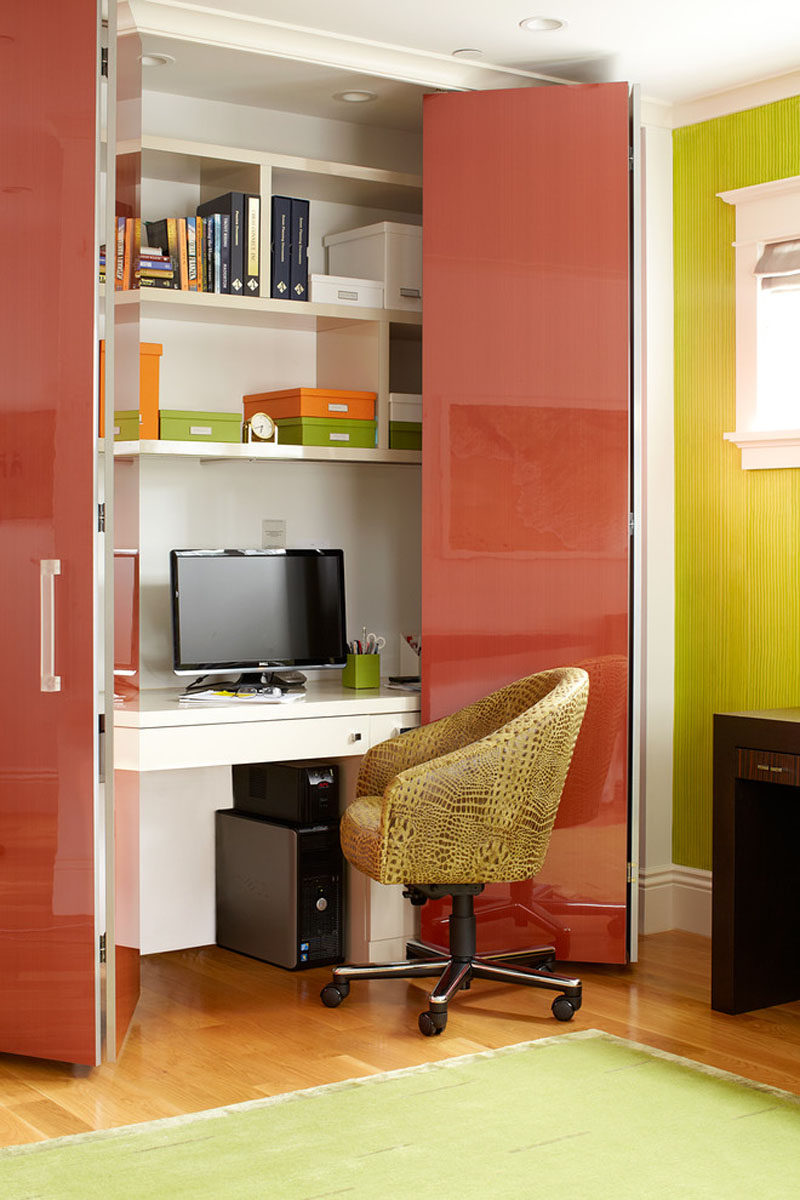 Small Apartment Design Ideas - Create A Home Office In A Closet // Colorful doors conceal this home office with built-in shelves when it isn't being used.