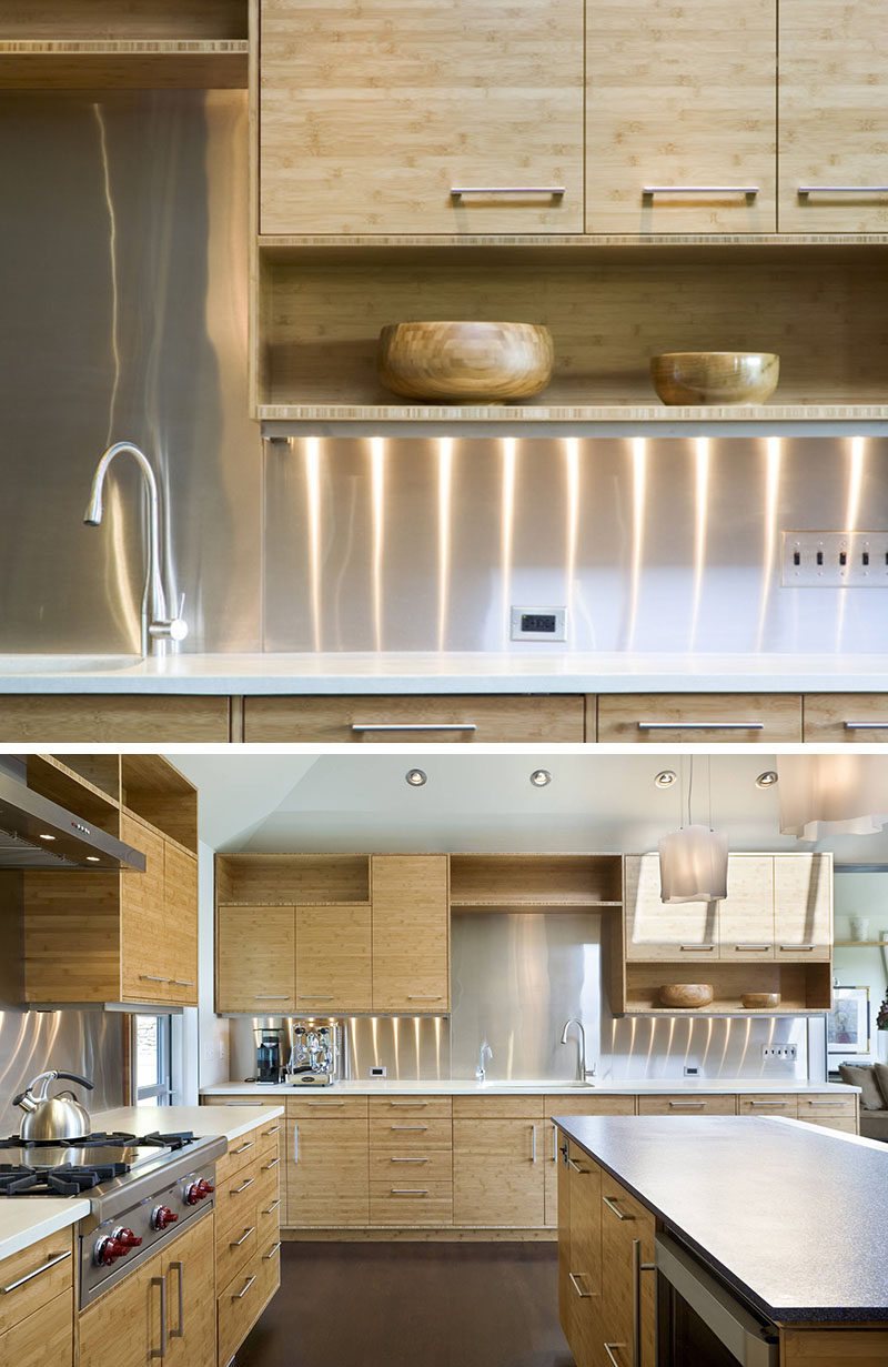 Kitchen Design Idea - Stainless Steel Backsplash // Bright, shiny stainless steel covers the backsplash areas of these kitchen walls to create a clean and modern look.