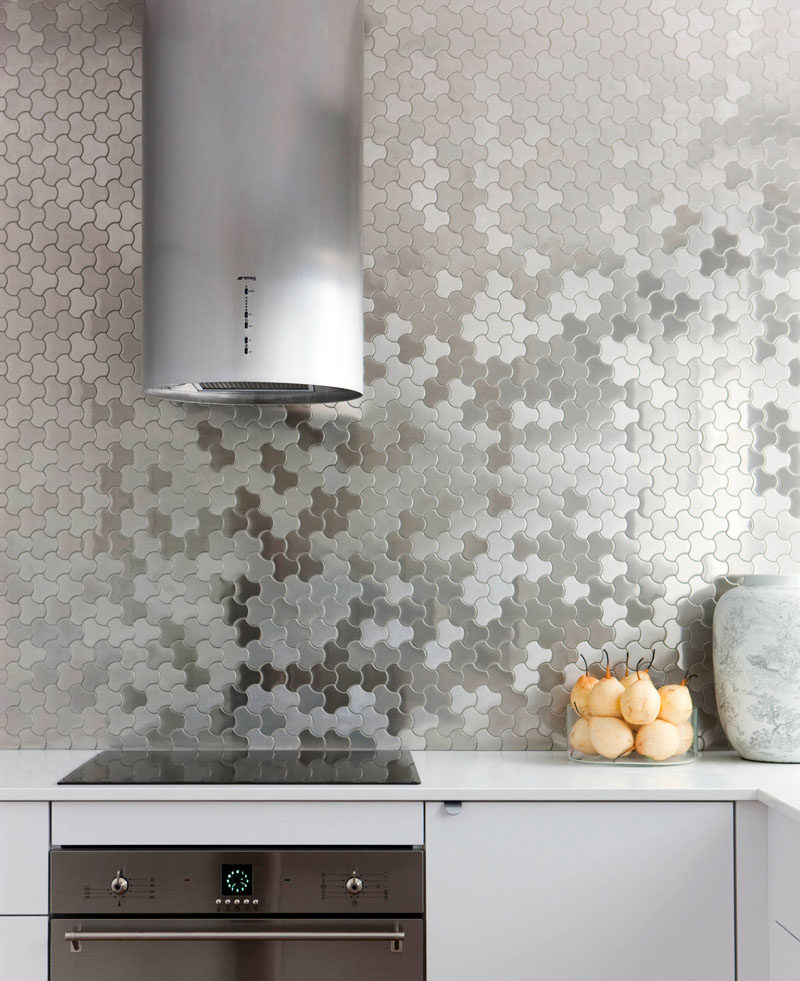 Kitchen Design Idea - Stainless Steel Backsplash // Stainless steel tiles cover the back wall of this modern kitchen to create a unique look that's easy to clean.