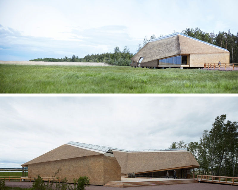 12 Examples Of Modern Houses And Buildings That Have A Thatched Roof // A skylight runs the length of the roof of this visitors centre, while the rest of the roof and the exterior walls are covered with thatch, in keeping with the natural surroundings.