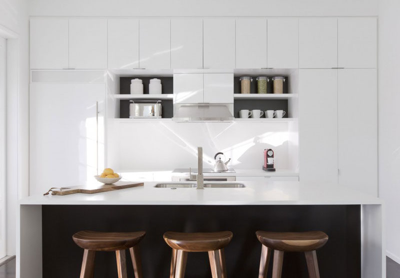 Kitchen Design Ideas - White, Modern and Minimalist Cabinets // There’s just the right amount of black in this kitchen to contrasts the all white cabinetry.