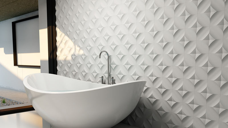 Bathroom Tile Ideas - Install 3D Tiles To Add Texture To Your Bathroom // The uniquely arranged tiles behind this bathtub create a wall full of texture and shape.