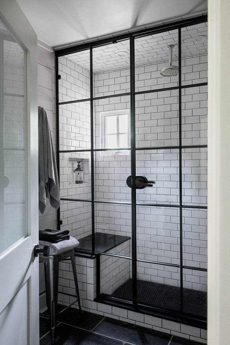 Bathroom Design Ideas - Black Shower Frames // The black window-like frame on the glass of this shower creates an industrial look in the bathroom and matches the small window pane on the opposite wall.