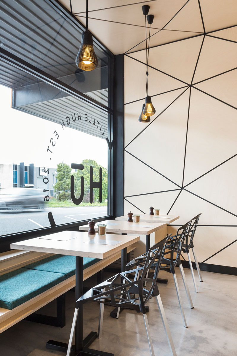 When designing this modern cafe, the designers experimented with computational geometry and Delaunay triangulation to develop the interior concept and branding. This resulted in the creation of the tessellated pattern that wraps from the walls around to the ceiling.