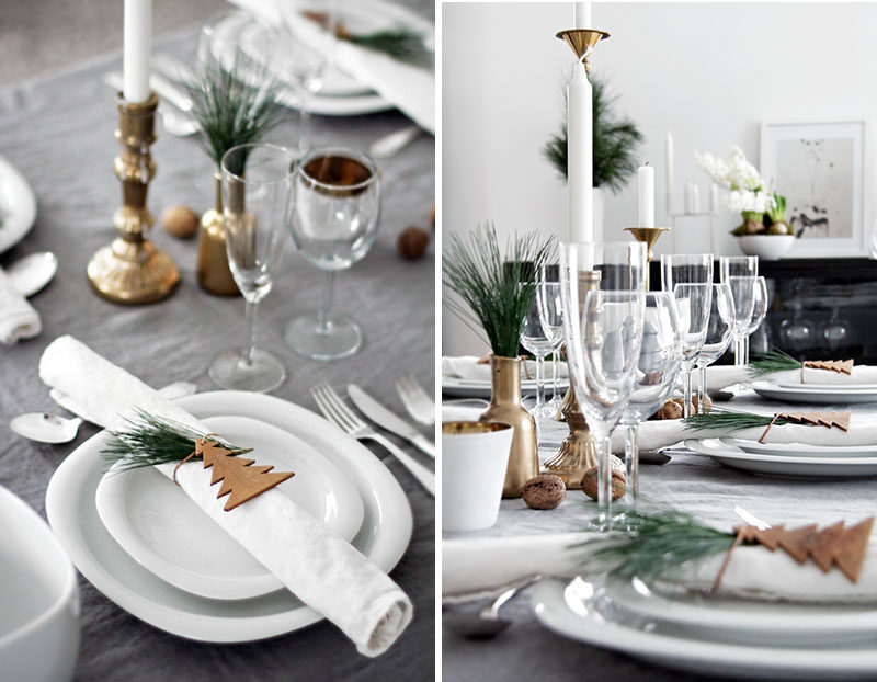 15 Inspirational Ideas For Creating A Modern Christmas Table Full Of Natural Elements // A simple wooden tree cut out secured around the napkin with twine and a sprig of greenery tucked between makes a simple and festive napkin holder.