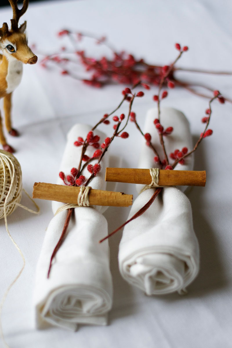 15 Inspirational Ideas For Creating A Modern Christmas Table Full Of Natural Elements // Cinnamon sticks and a small branch of berries secured to each napkin with twine or raffia keeps the table looking fun and the room smelling great.
