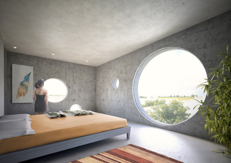 All of the rooms of this concept home have large circular windows with views of the surrounding area, which is perfect as the home has been designed to be a weekend retreat for city dwellers.