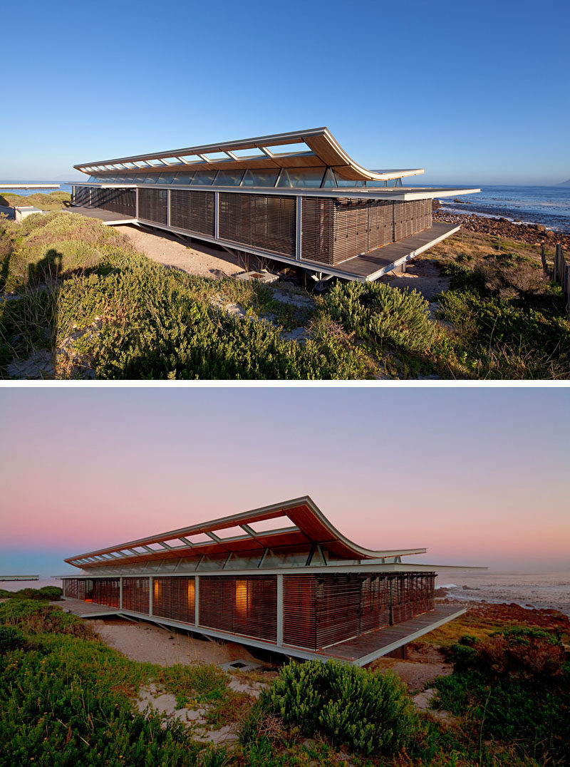 14 Examples Of Modern Beach Houses // This South African beach house is as close to the sea as it possibly can be and opens completely to make it feel like you’re on the beach even while you’re cooking dinner or lounging on the sofa.