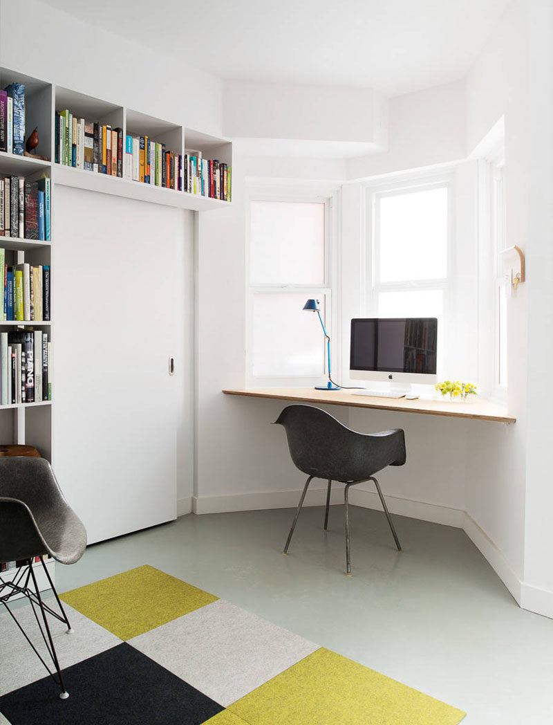 16 Wall Desk Ideas That Are Great For Small Spaces // A wall desk installed under a window makes the most of natural light lets you look out the window while you work.