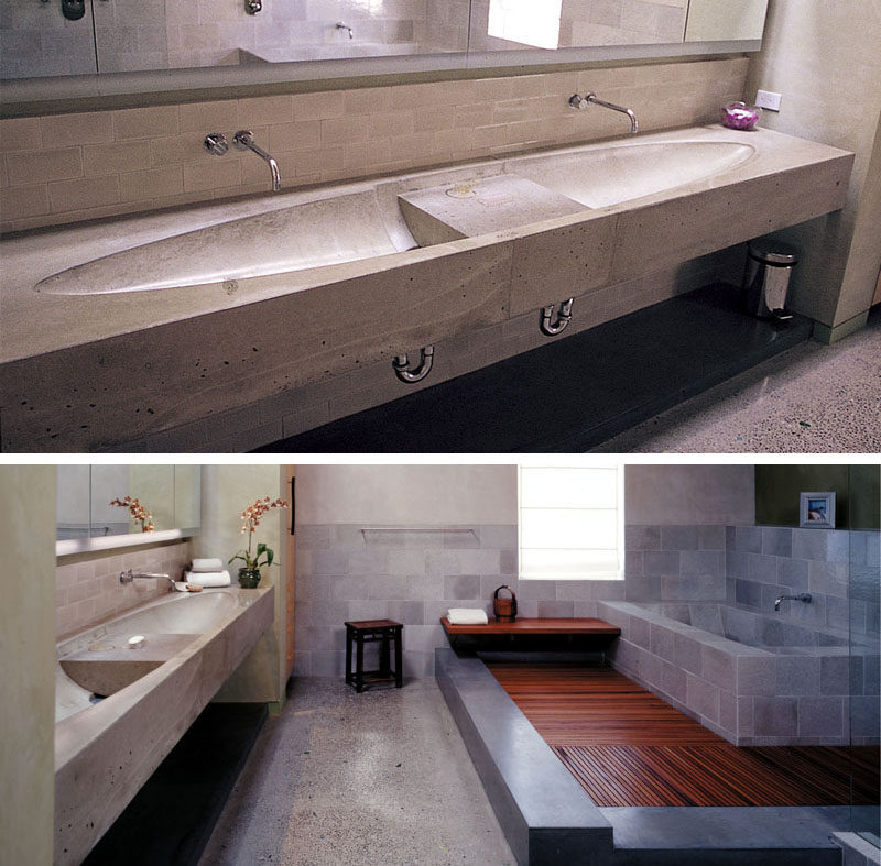 11 Creative Concrete Countertop Designs To Inspire You // This bathroom in a penthouse had a concrete countertop with dual sinks in an elliptical design.