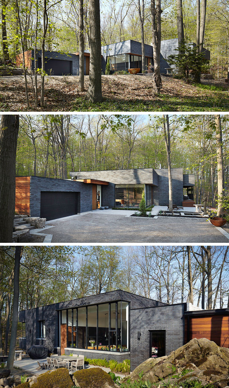 18 Modern House In The Forest // The contrast between the black brick and wood panels on this forest home make it stand out in the lush forest around it.