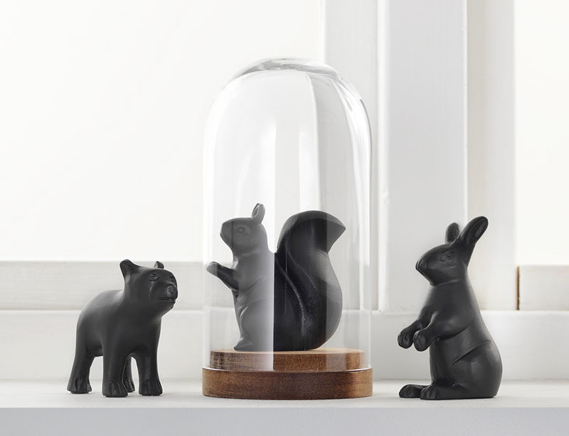 18 Decorative Animal Objects That Blur The Line Between Toys And Decor // Putting decorative animals under a glass dome adds even more of decorative feel to your display.