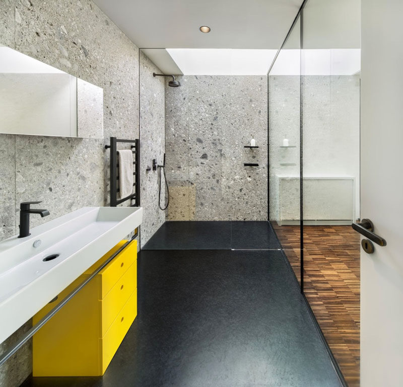 Bathroom Design Idea - Extra Large Sinks Or Trough Sinks (20 Pictures) // Matte black hardware and a bright yellow drawer unit coupled with the long white trough sink, give this bathroom a fun, modern vibe.