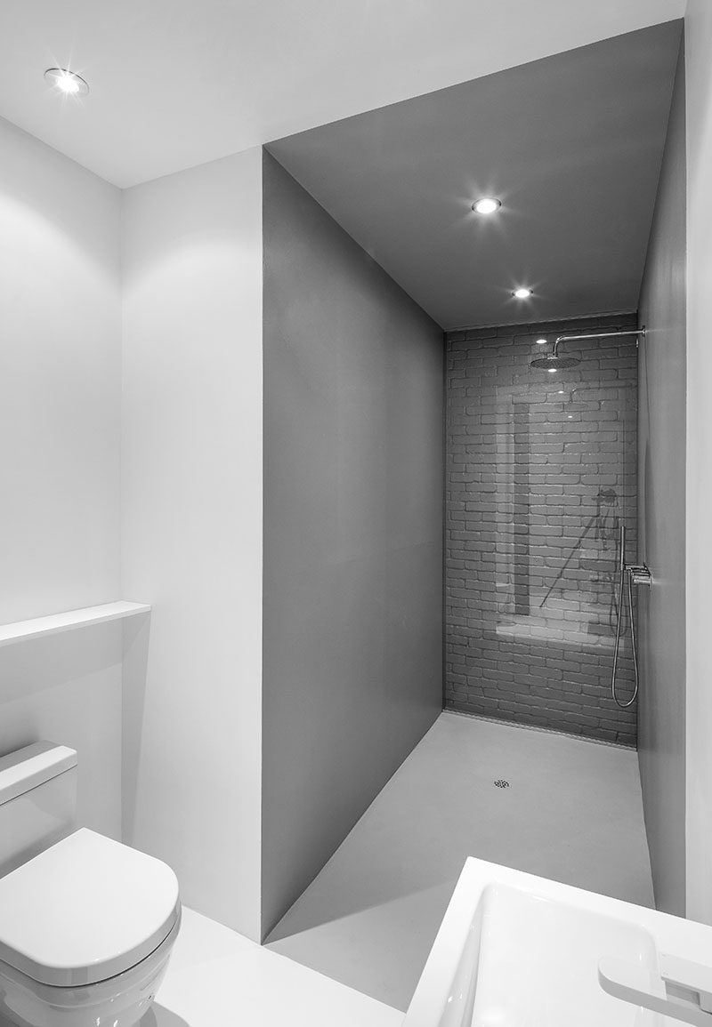 Bathroom Design Idea - Use Glass To Cover An Original Brick Wall In The Bathroom So You Can Still Enjoy It