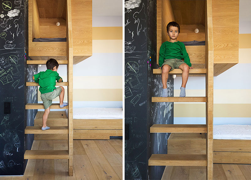 To reach this kids cubby, there's a ladder to climb that runs along side a chalkboard wall.
