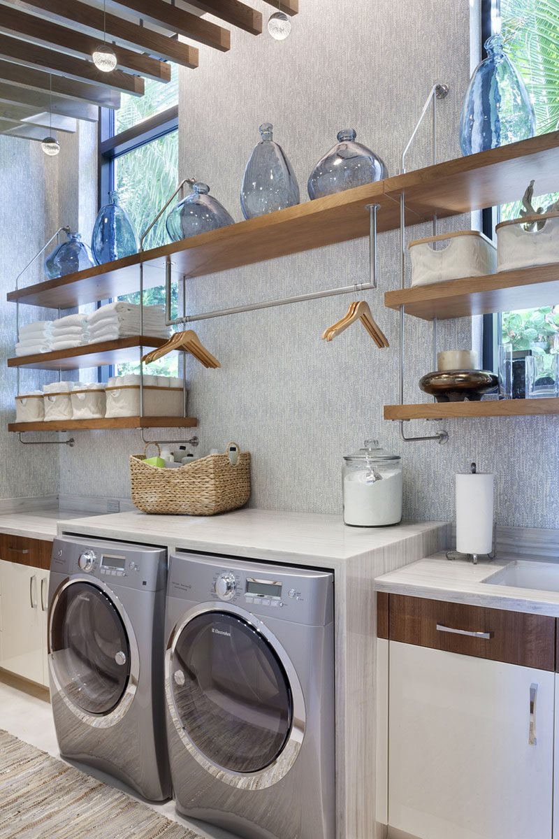 7 Laundry Room Design Ideas To Incorporate Into Your Own Laundry // A hanging bar for drip drying clothes
