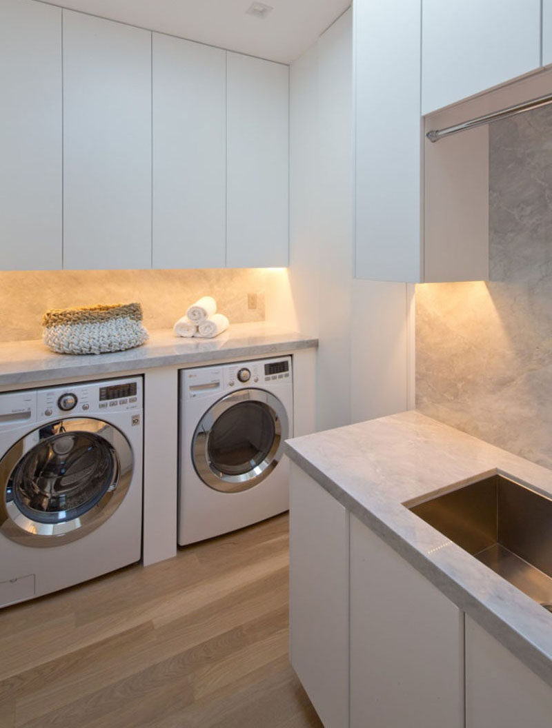 7 Laundry Room Design Ideas To Incorporate Into Your Own Laundry // Custom designed unit for housing the washer and dryer