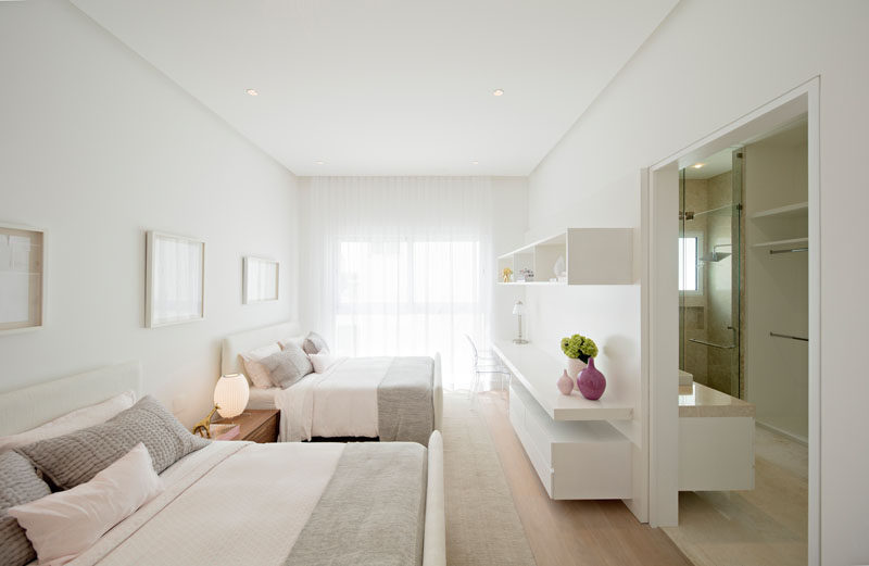In this bedroom, soft grays and white walls create a calming atmosphere.