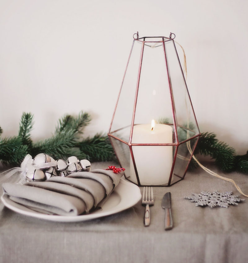 15 Inspirational Ideas For Creating A Modern Christmas Table Full Of Natural Elements //A few small lanterns or a couple of larger ones placed down the middle of your table make a beautiful centerpiece and create moody lighting perfect for a Christmas dinner.