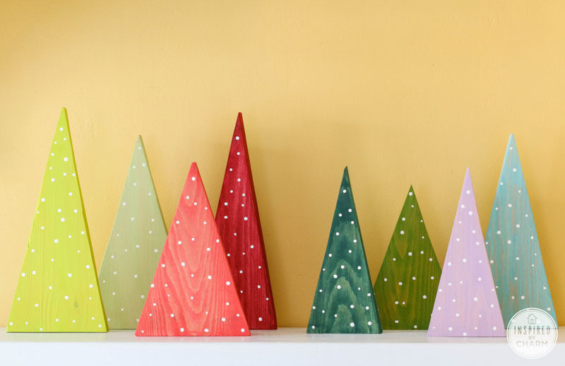 30 Modern Christmas Decor Ideas For Your Home // Add a bit of fun to your mantle with these simple colorful Christmas trees.