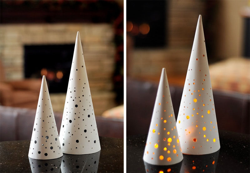30 Modern Christmas Decor Ideas For Your Home // Fake tealights placed under these perforated Christmas trees create a warm glow and add a coziness to your home.